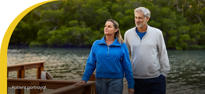 patient couple together on a dock